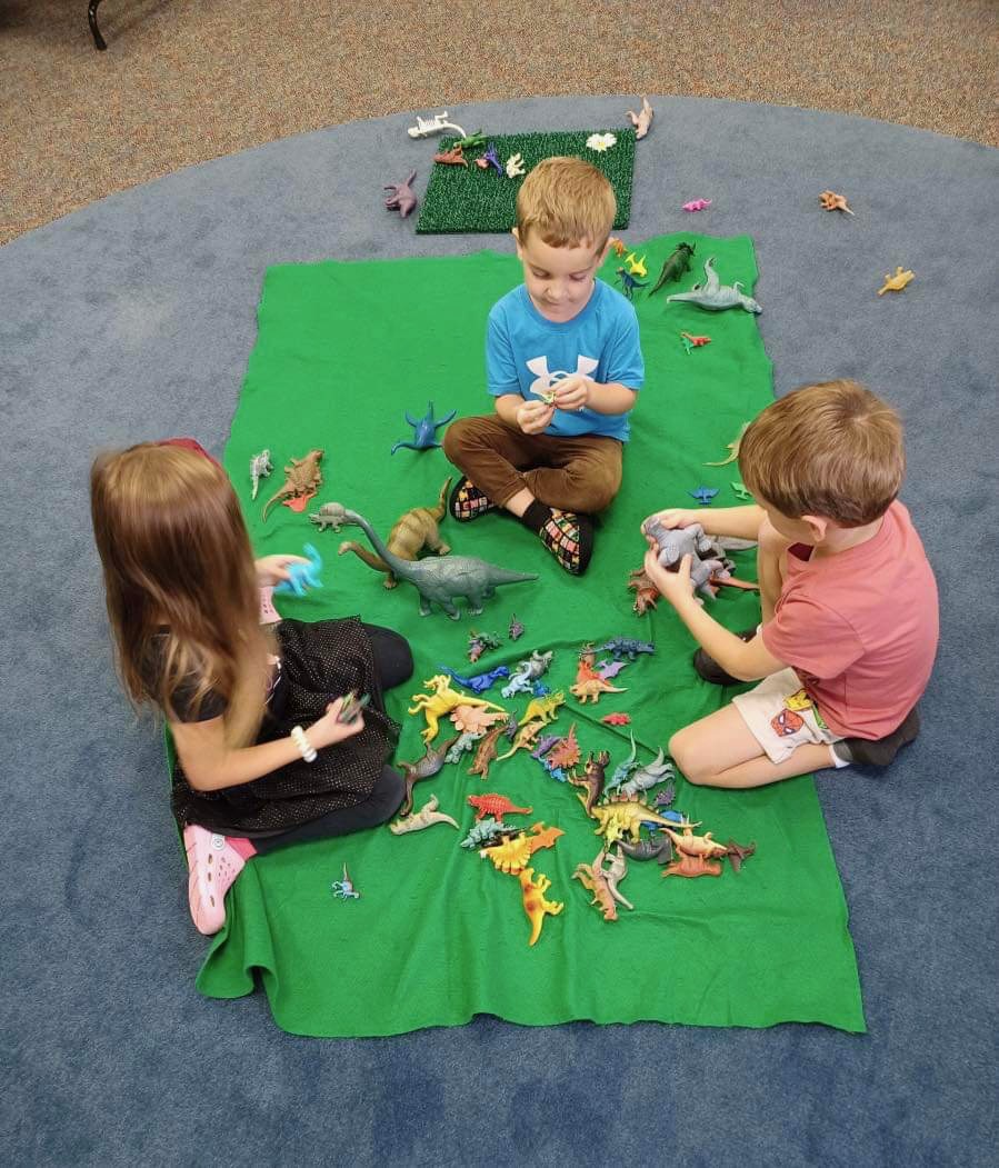 kids playing with dinosaurs